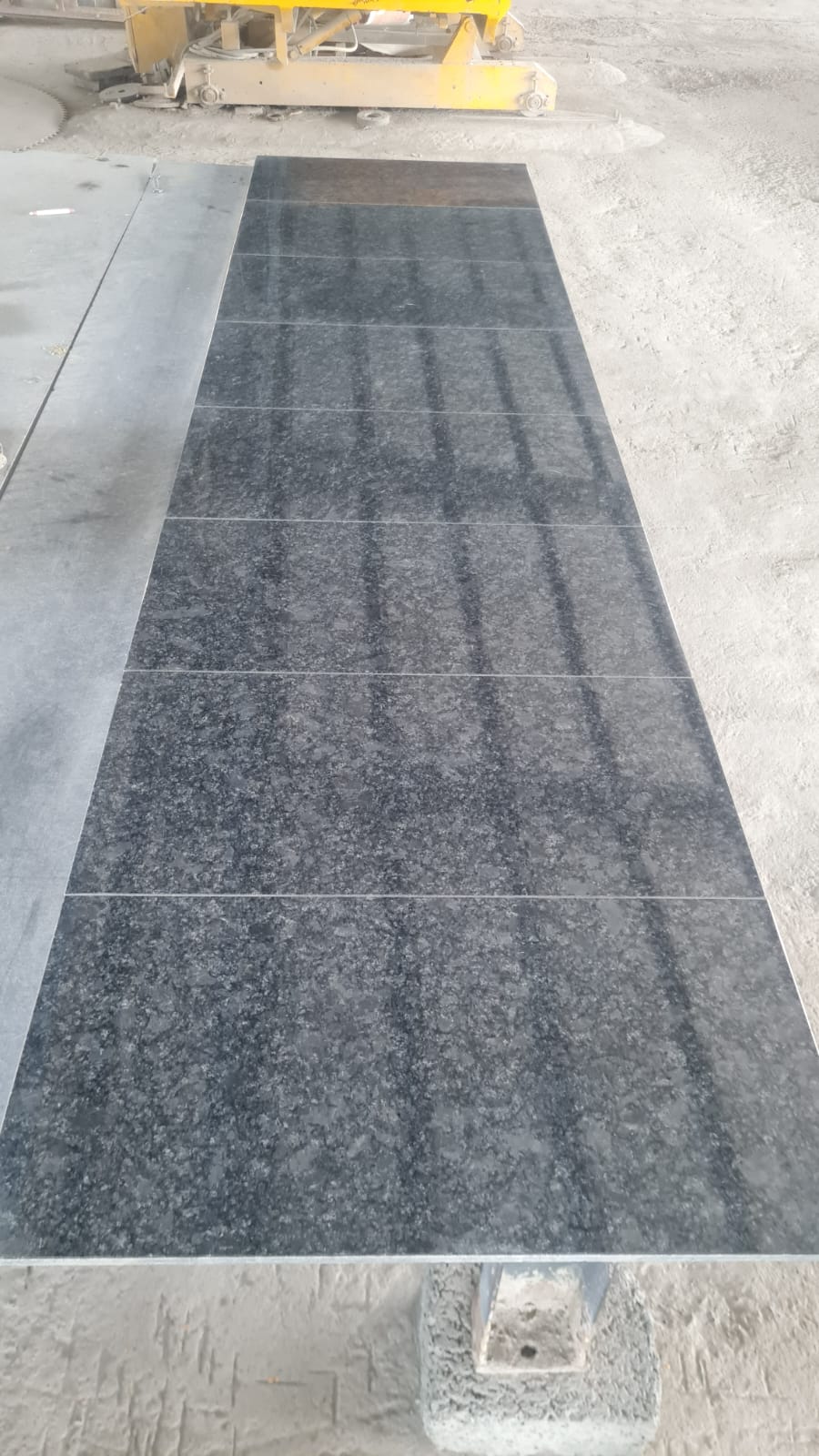 Close-up of the Steel Grey granite surface showing a dark grey base with lighter flecks